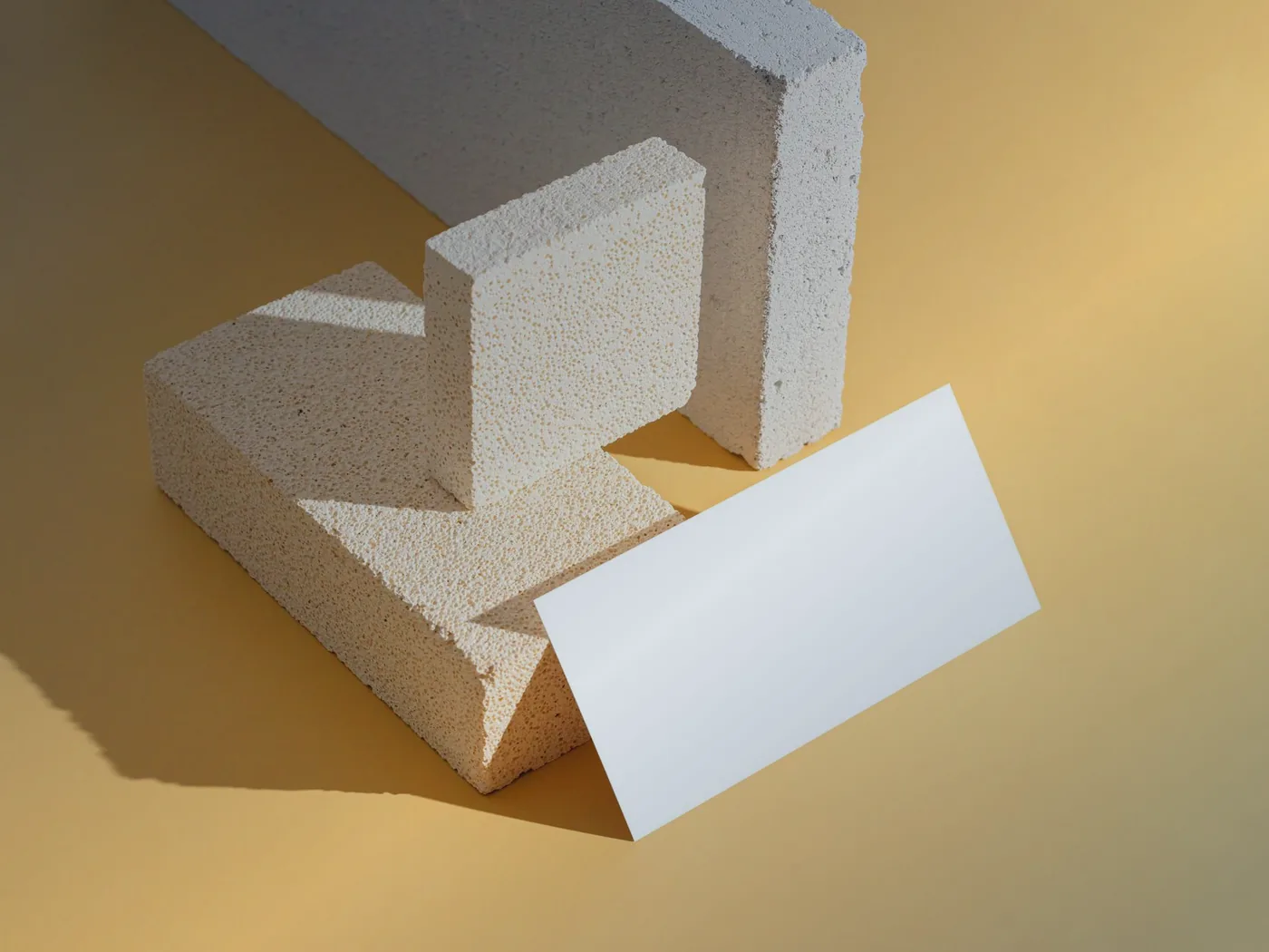 Lightweight construction blocks stacked on a coloured background
